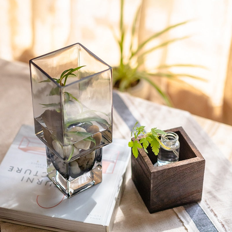 Glass square vase with wooden base