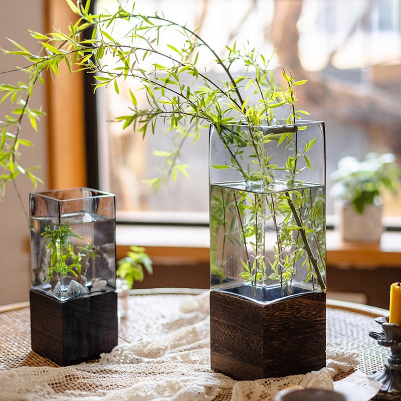 Glass square vase with wooden base