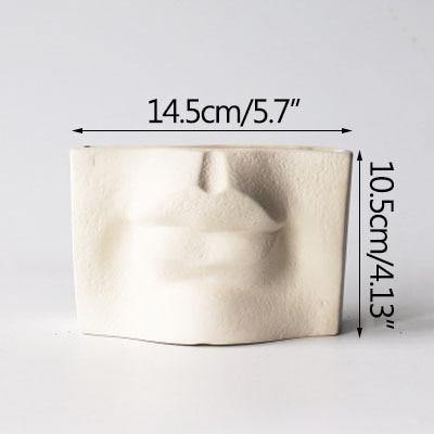 Abstract ceramic face vase decor - Leaf and Leisure